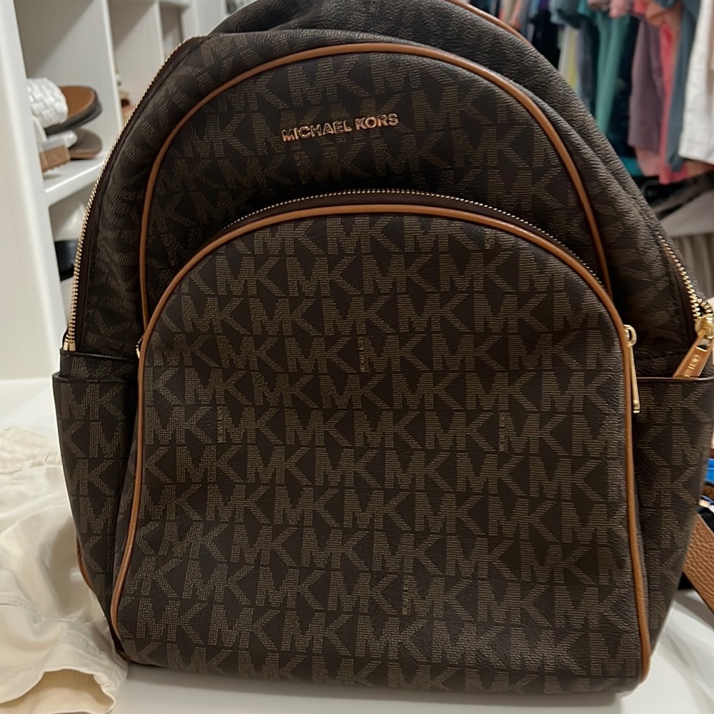 Brown Michael Kors back back. Only used 3 times.  Size approximately 15x13.